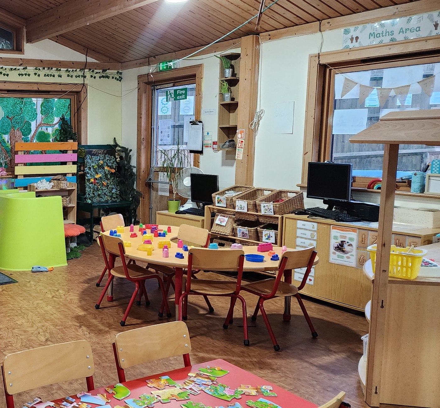 Dickory Docks classroom set up with activity tables and resources